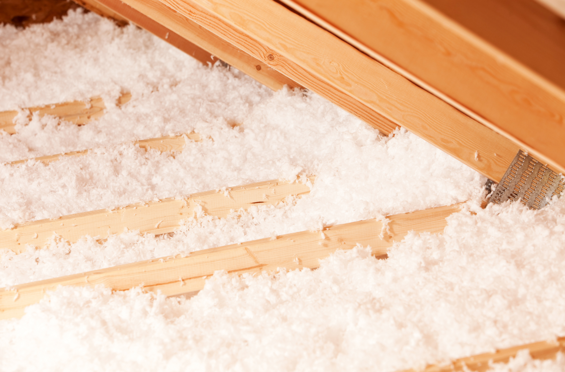 a close up of a ceiling with insulation and wires .